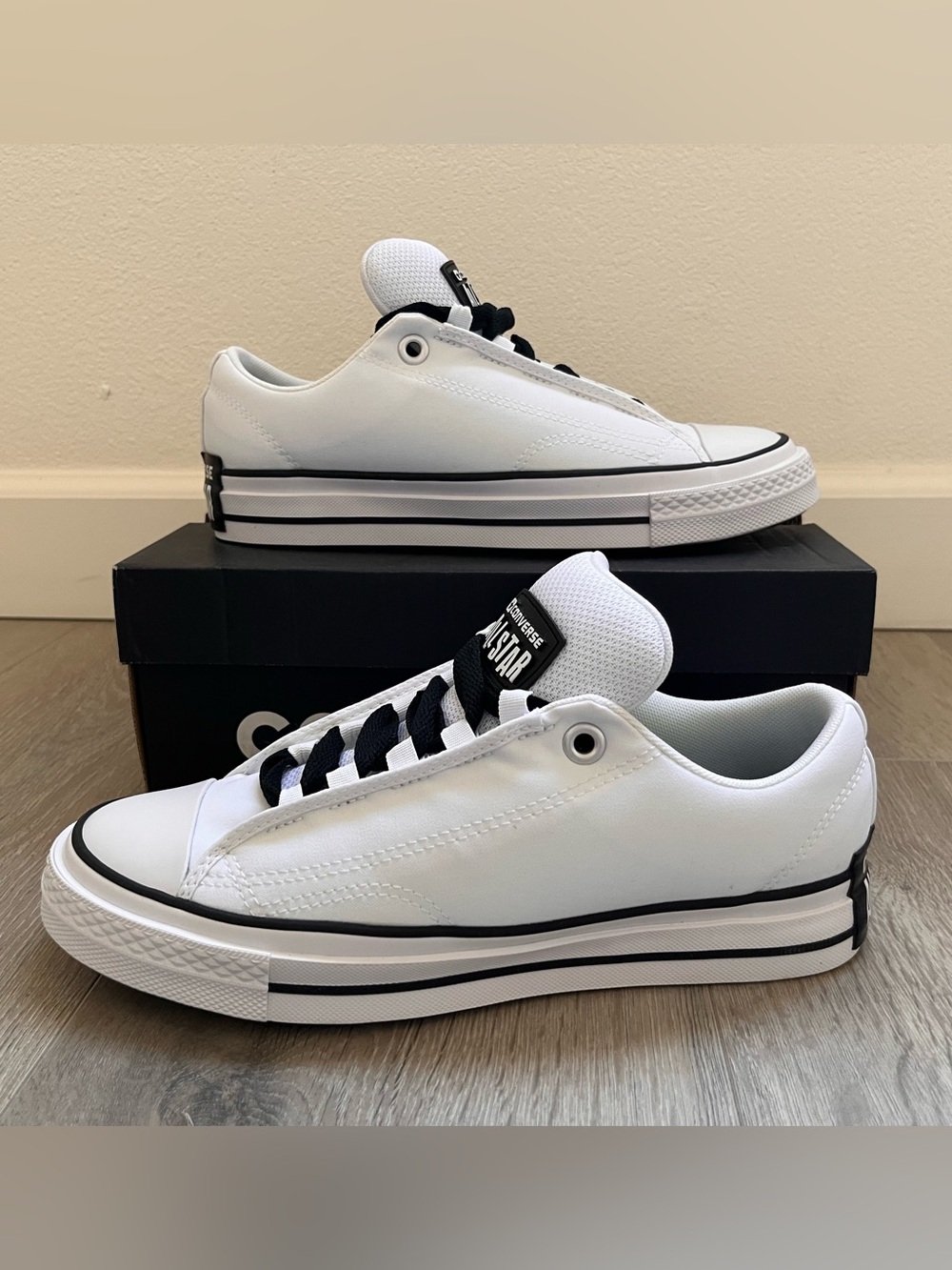 Converse Low Top Sneakers in White with Black Trim